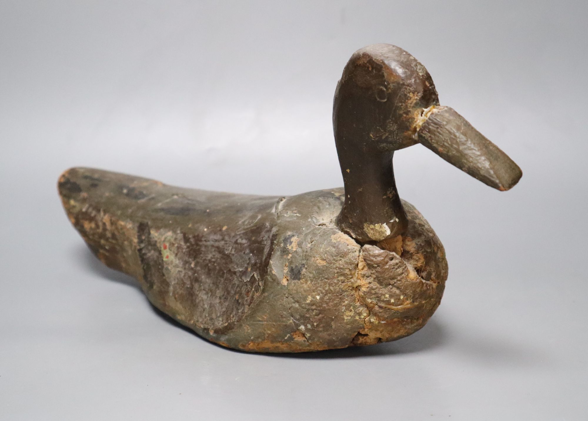 A carved wood decoy duck, length 42cm